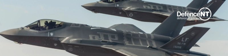 Two planes flying in the air.