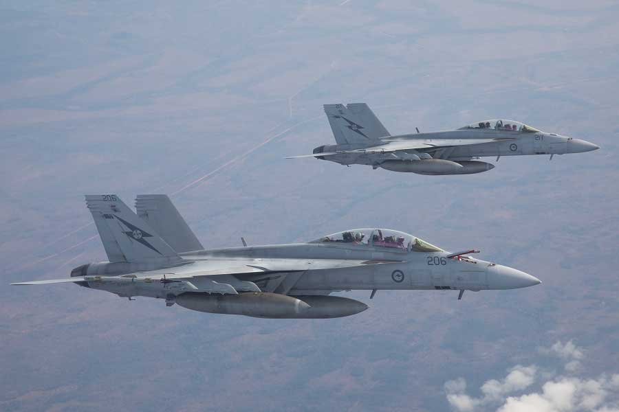 Two Royal Australian Air Force F/A-18F Super Hornets prepare to refuel 